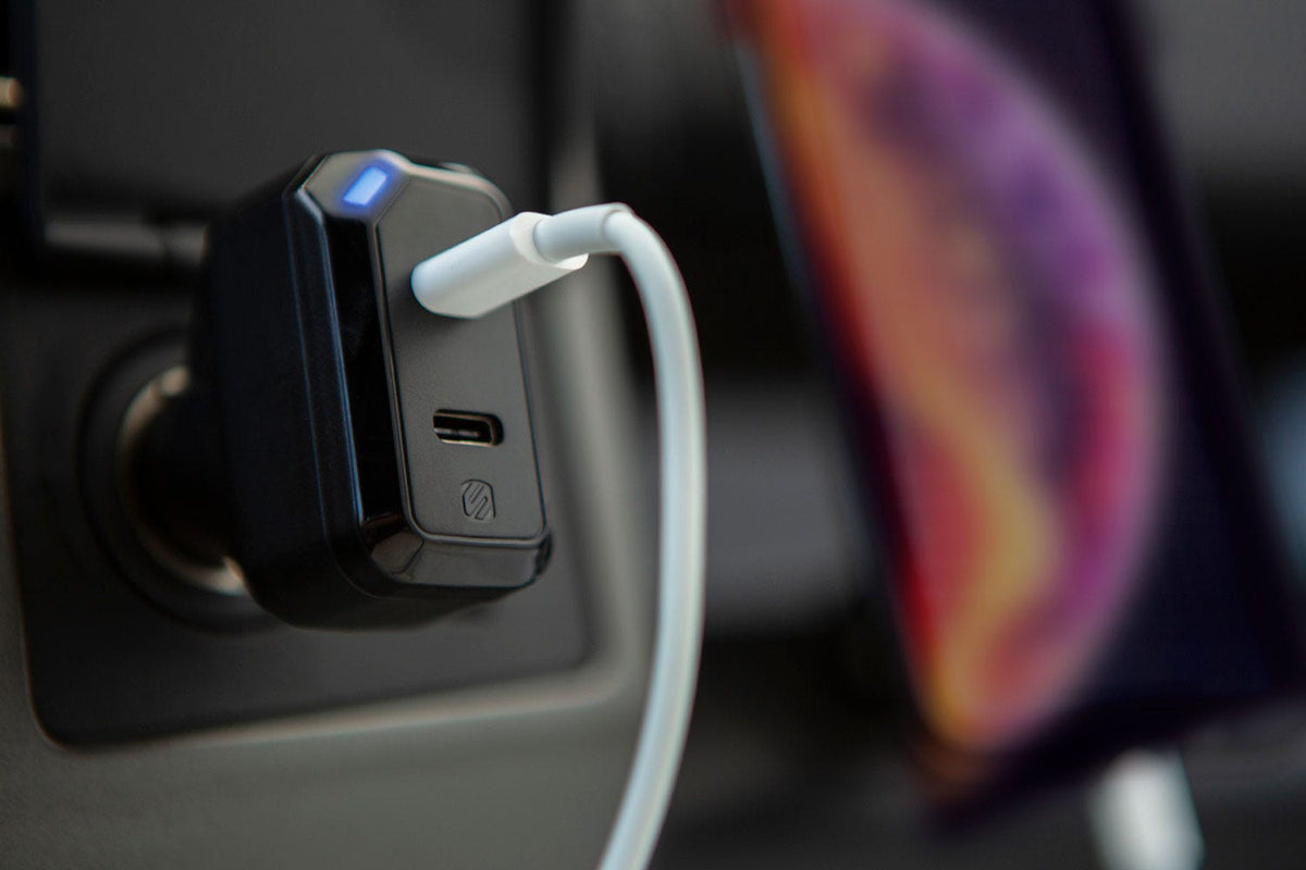 fast charger in car 12V socket with white charging cable
