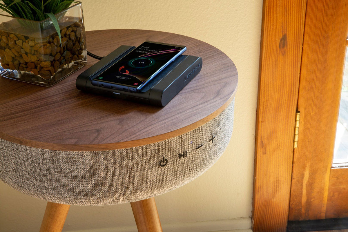 Samsung phone charging via Scosche wireless charging pad on table