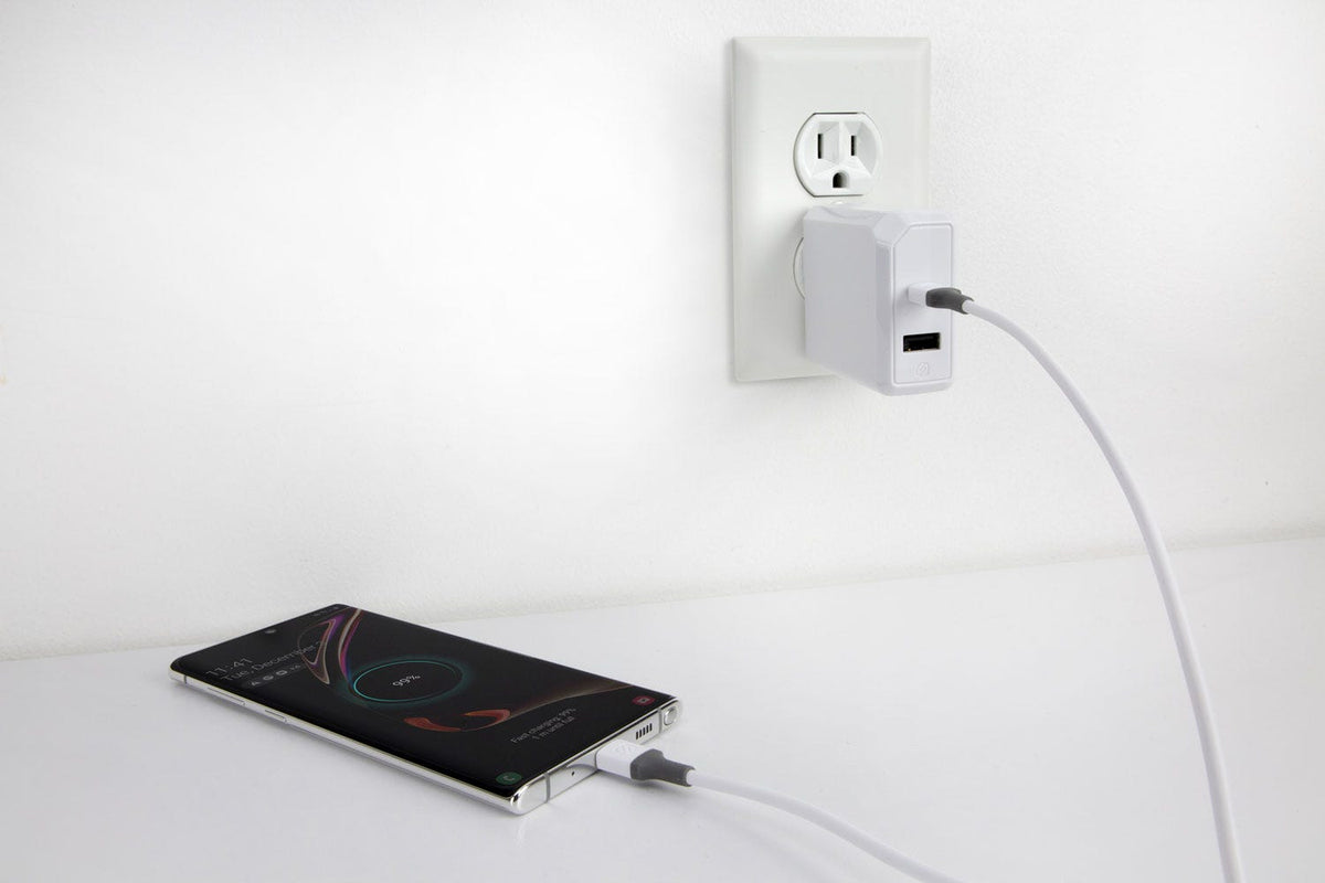 phone charging via Scosche charging cable plugged into dual port wall outlet