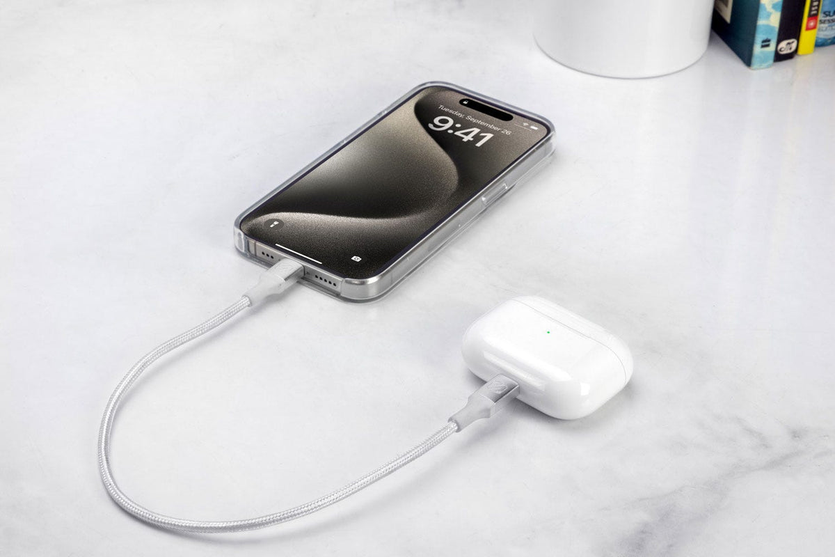 iphone syncing with Airpods via Scosche braided cable on countertop