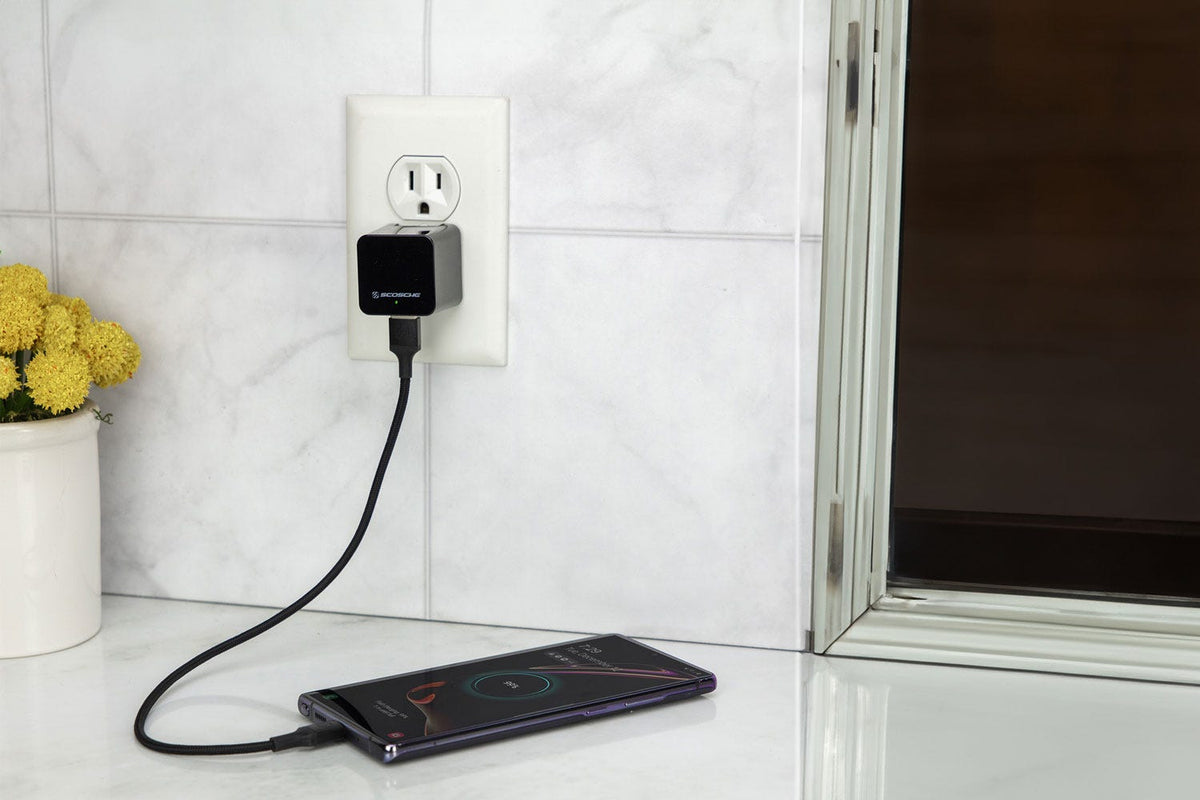 phone charging on countertop via Scosche braided charging cable and quick charge wall charger