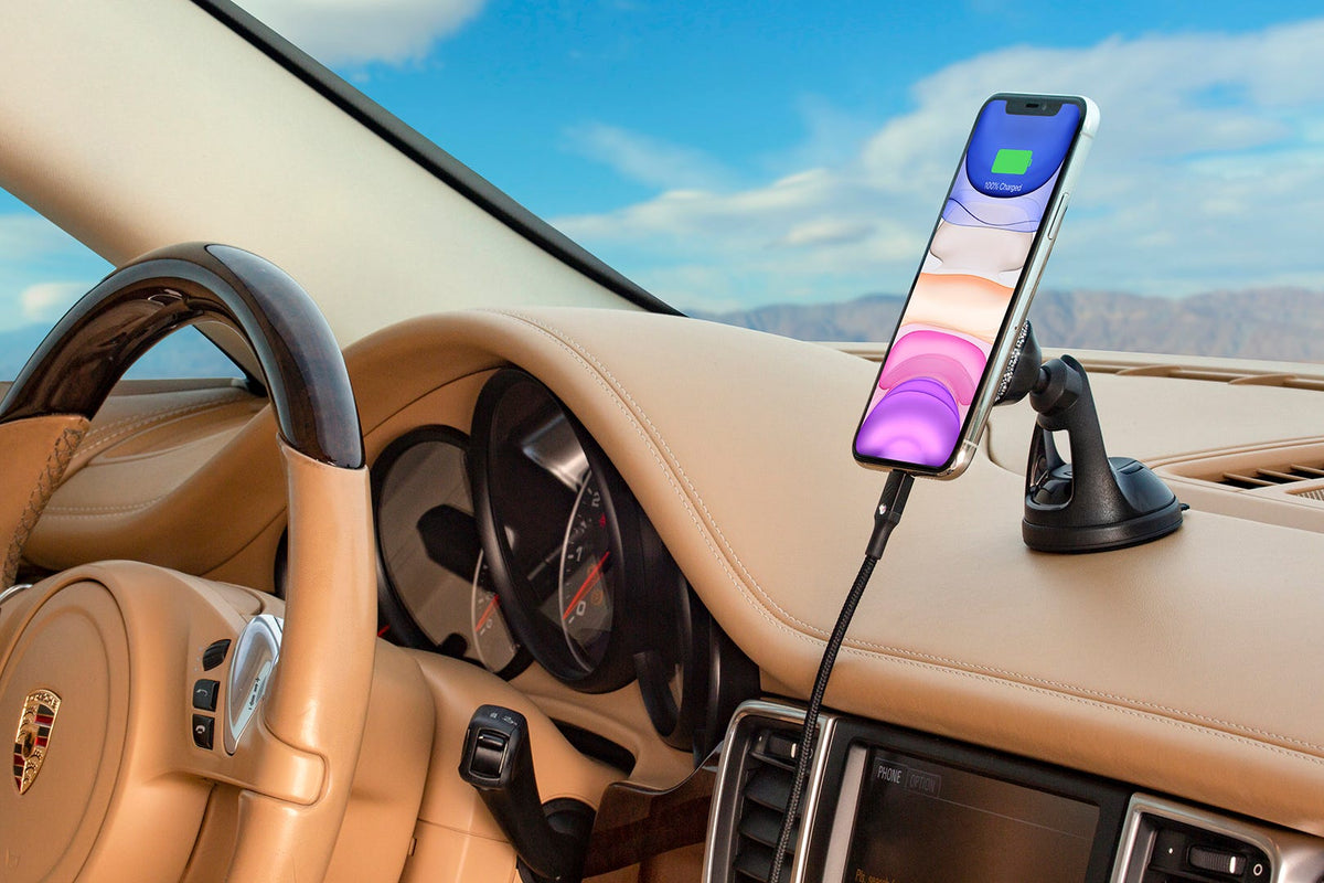 iphone charging via Scosche charging cable mounted to Scosche mount on car dash with tan interior