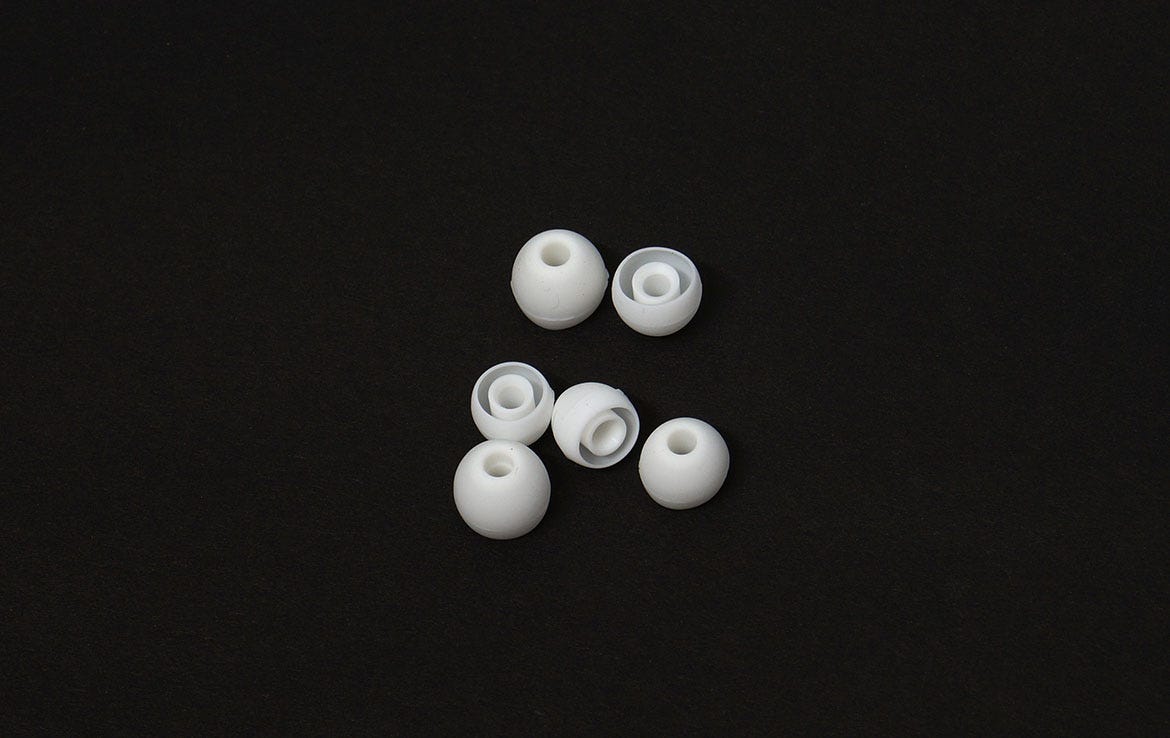 close up of 6 white ear buds