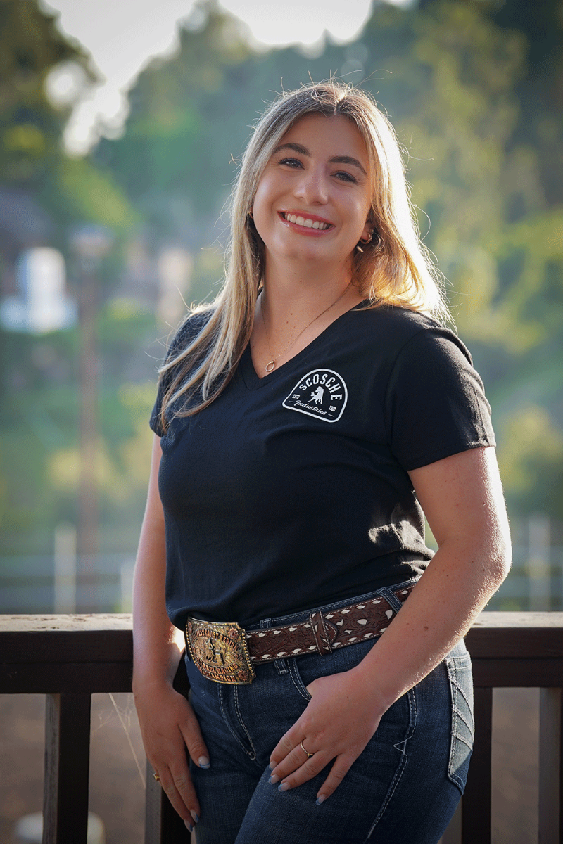 Woman wearing Scosche Ladies' Tee with Bronco Logo