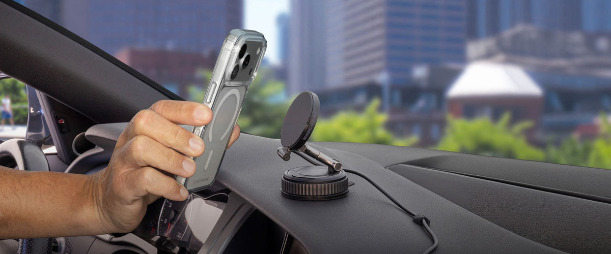 iPhone Being Held Up to Wireless Charger on Dashboard