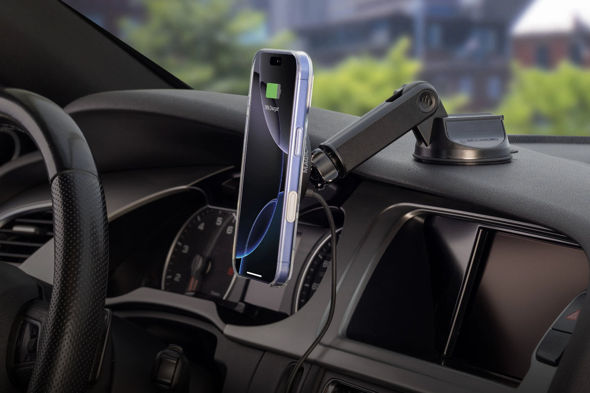 iPhone attached to mount angled down from where it is attached on top of a vehicle's dashboard