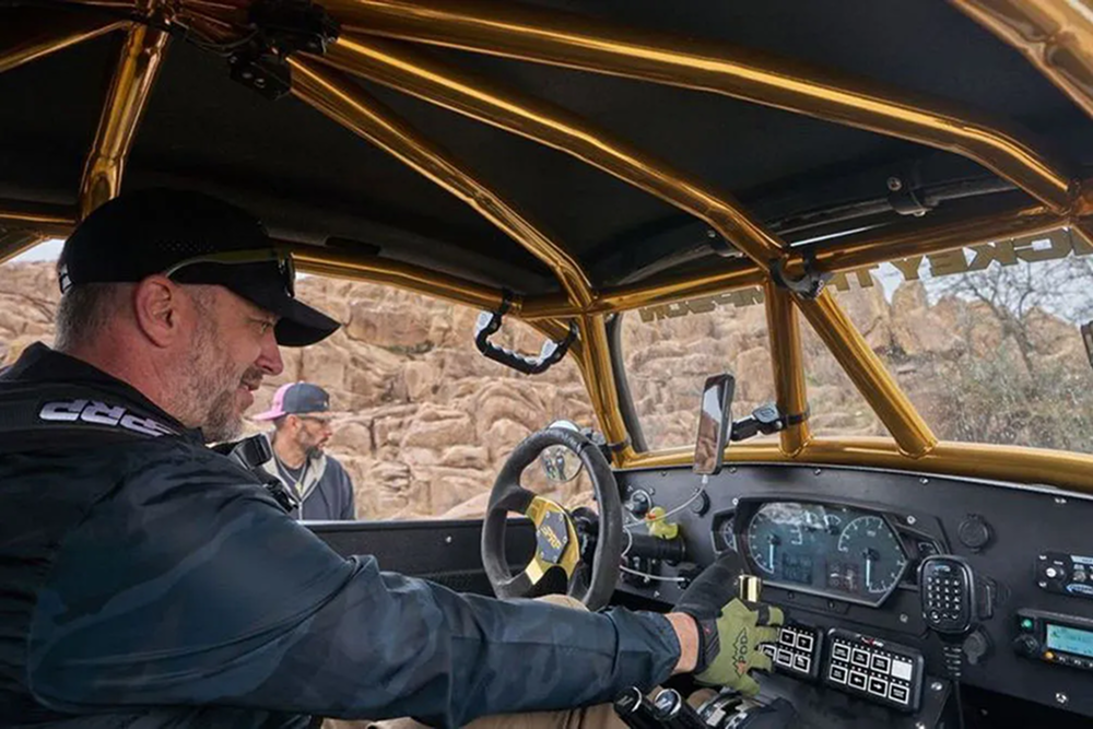 Interior of modified off-road vehcile with man driving
