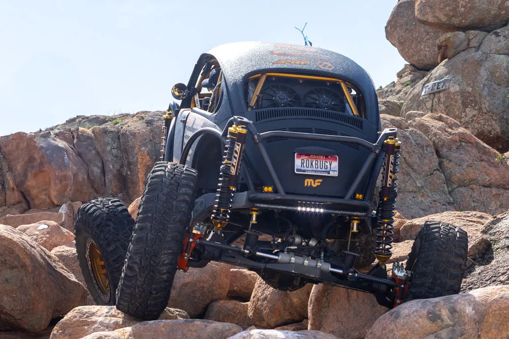 Offroad vehcile traversing large rocks