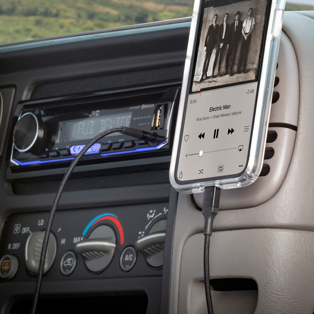 image of Auxilary to Lightning Cable connected to car and iPhone
