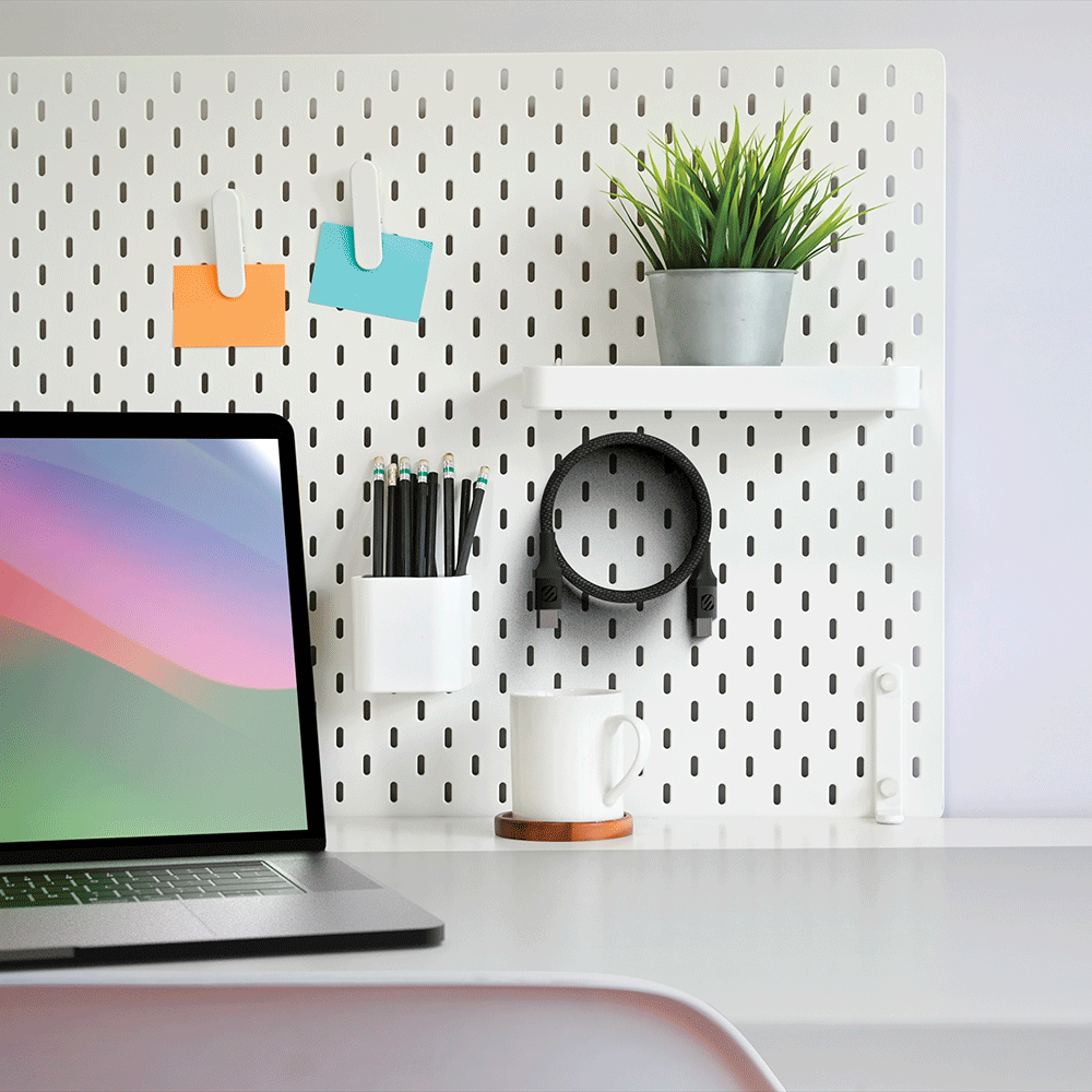 USB-C to USB-C 60Watt 6 Ft. Magnetic Braided Charging Cable coiled and hanging on office pegboard