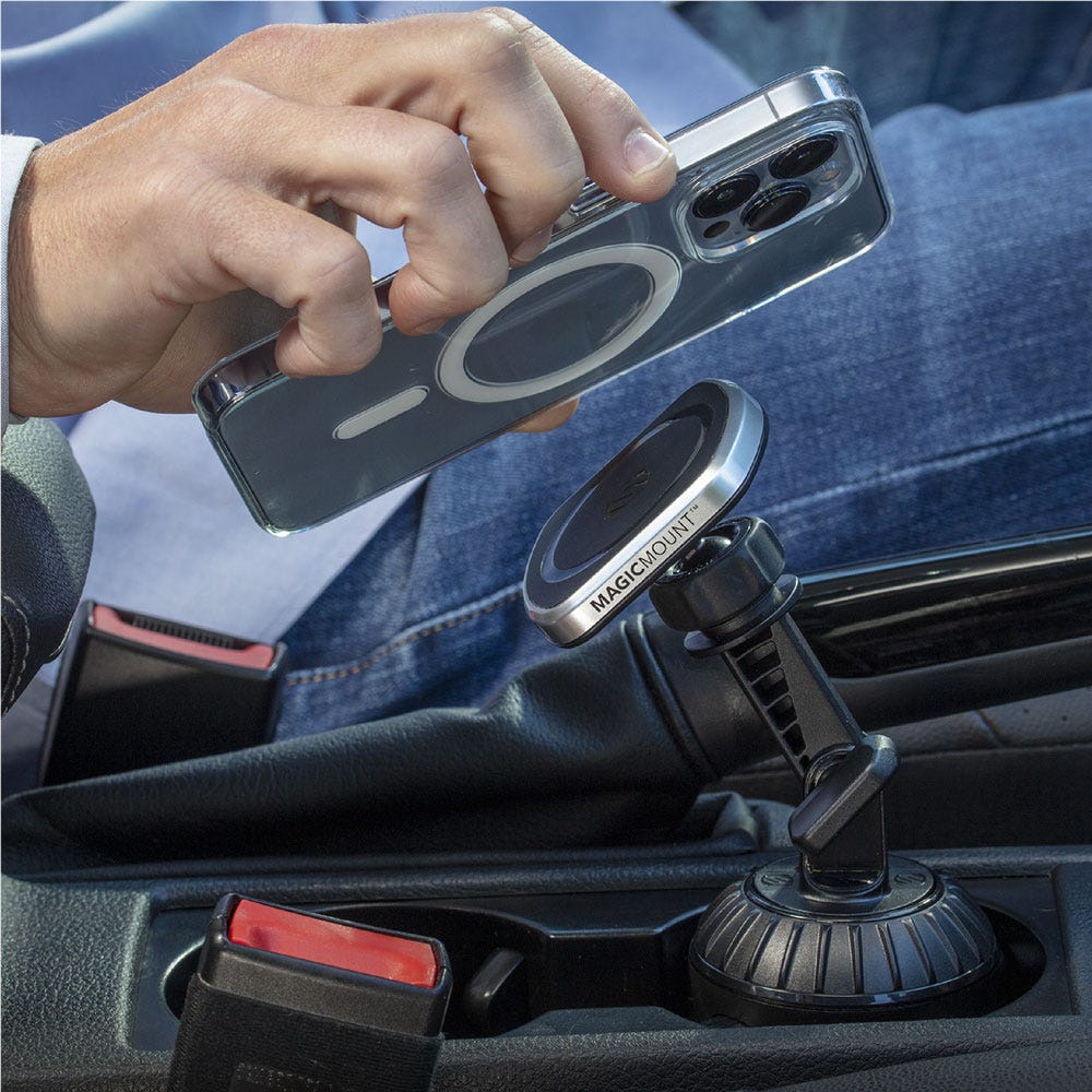 iPhone being placed on magnetic cup holder phone mount