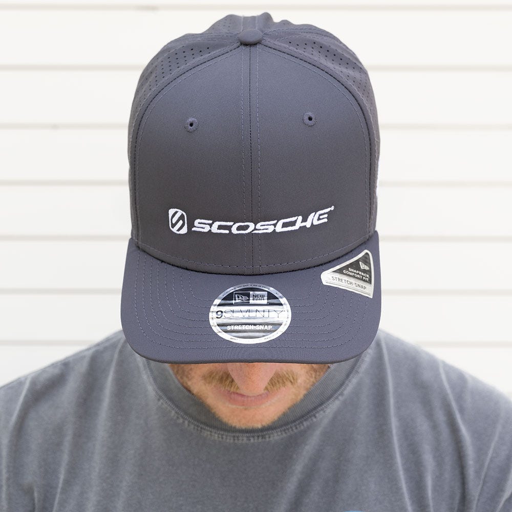 Man with head down to show gray Scosche hat
