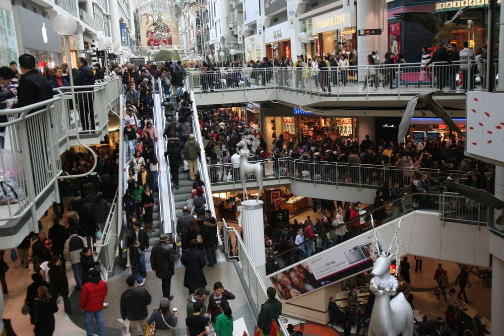 dense crowd in shopping mall during holiday season