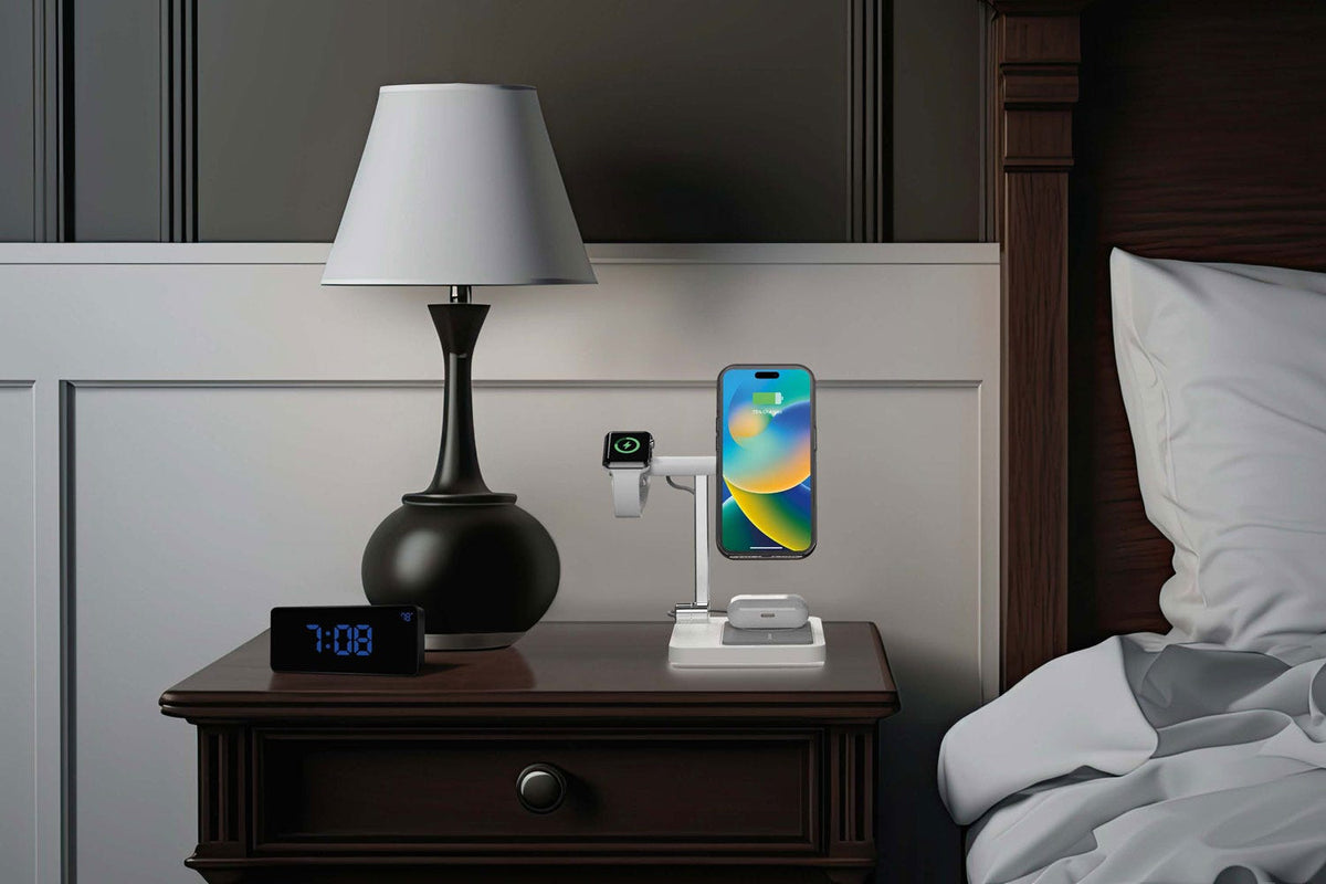 Apple watch, iphone and Airpods charging on wireless folding charging stand on nightstand next to bed
