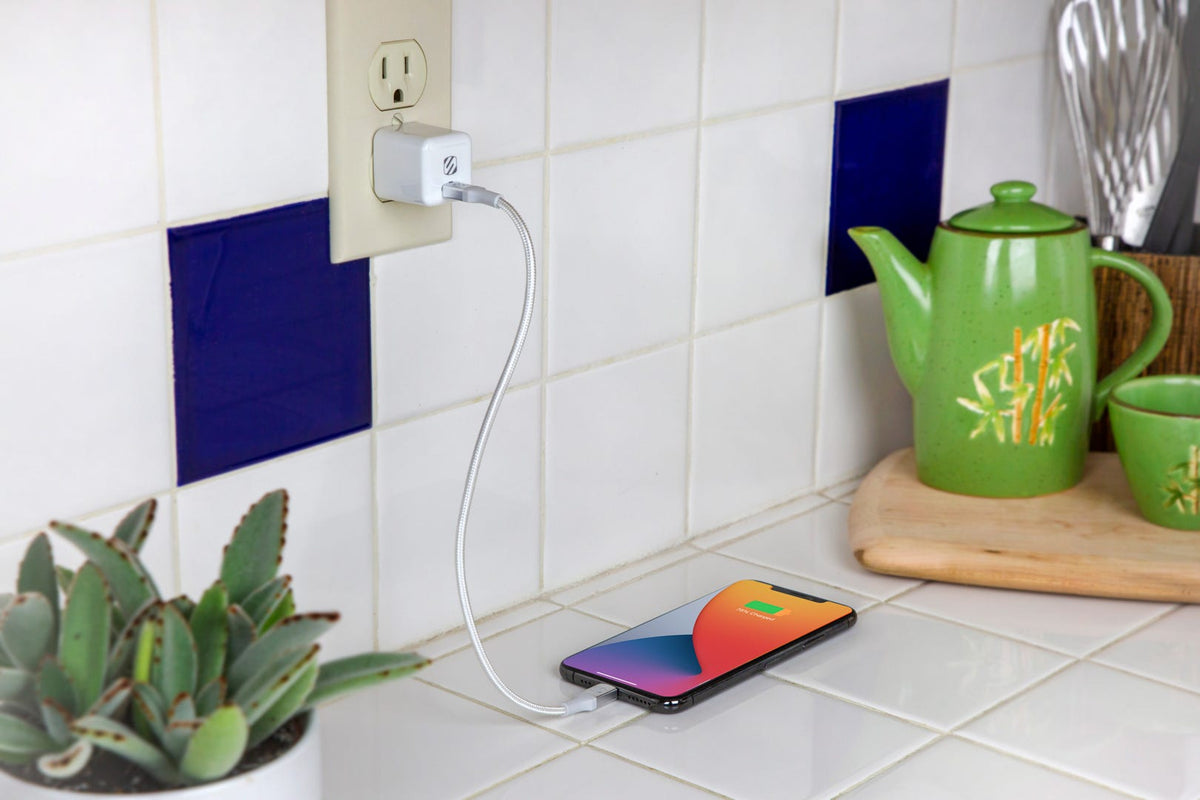 iphone charging via Scosche cable and wall charger while sitting onkitchen counter