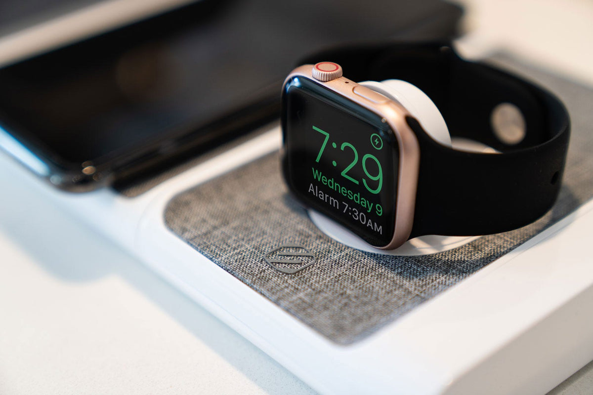 Apple watch charging on Scosche wireless charging pad and phone charging on Scosche wireless charging pad