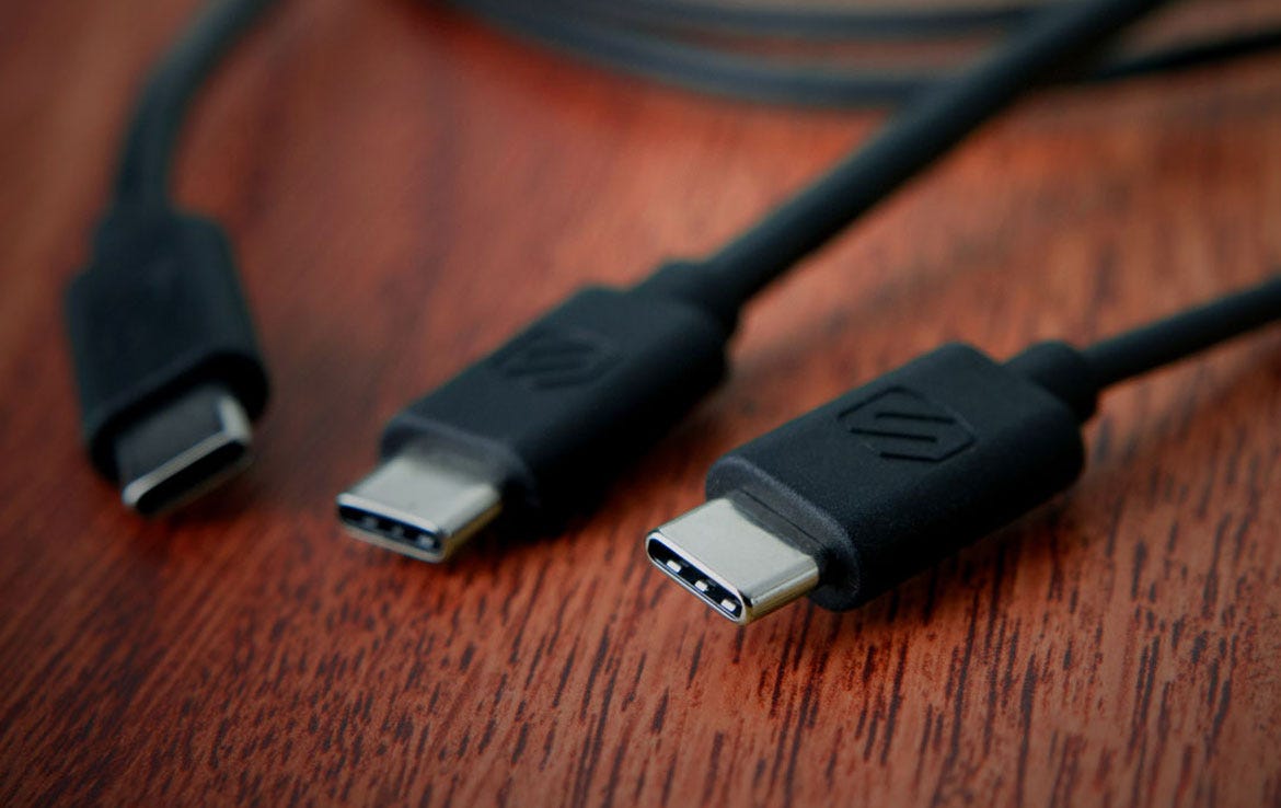close up of USB-C cables on wood table