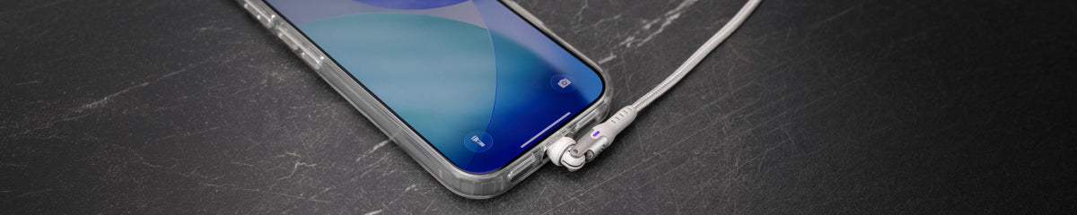 iPhone with a white pivot cable plugged into the bottom