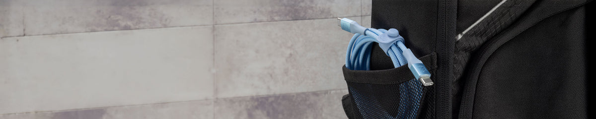 Blue USB-C cable coiled up in a backpack pocket