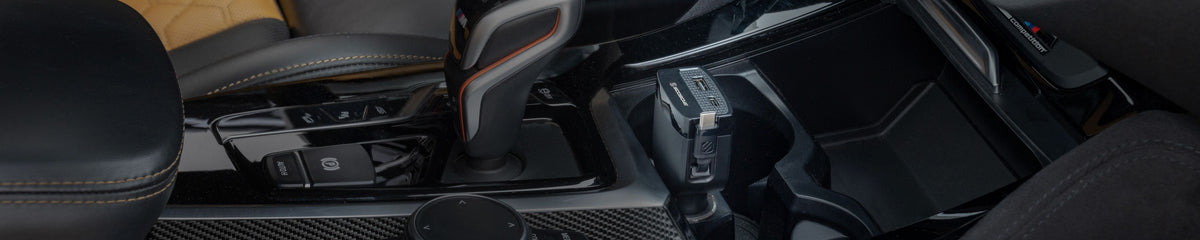 Vehicle console with USB-C car charger plugge into 12V power outlet