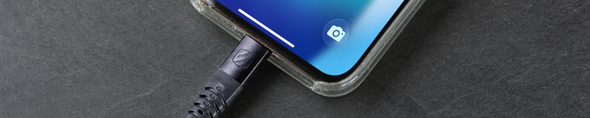 Closeup shot of a cable being plugged into an iPhone
