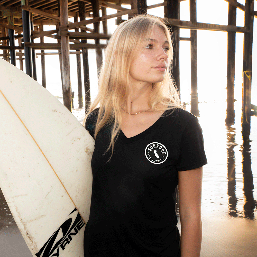 Woman wearing Scosche Ladies' Tee with Cali Logo