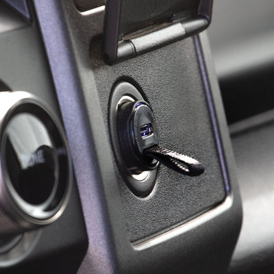 USB-C Charger plugged into 12V port in a vehicle
