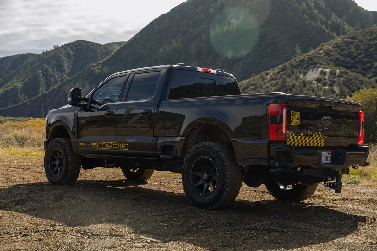 Back of Ford F-250 with green hills behind