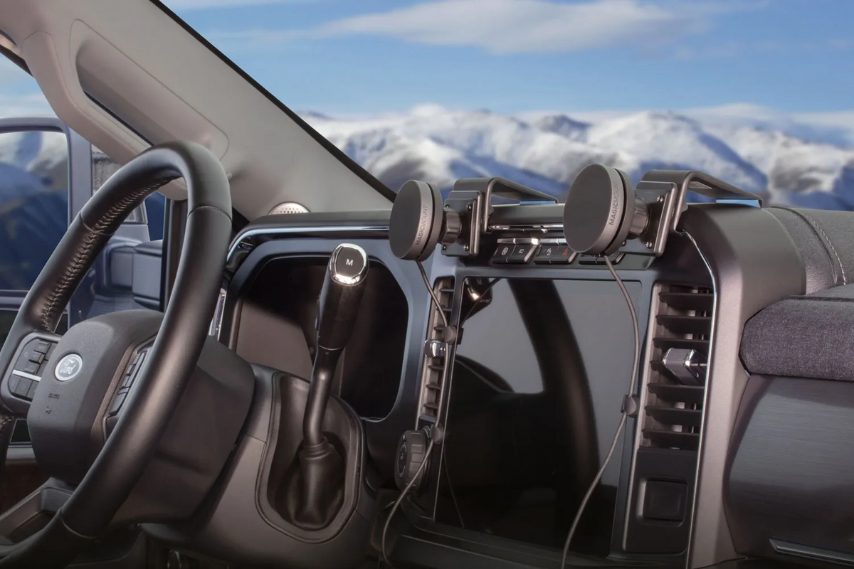 Interior shot of Ford F-250 console with two magnetic phone mounds attached to the dashboard