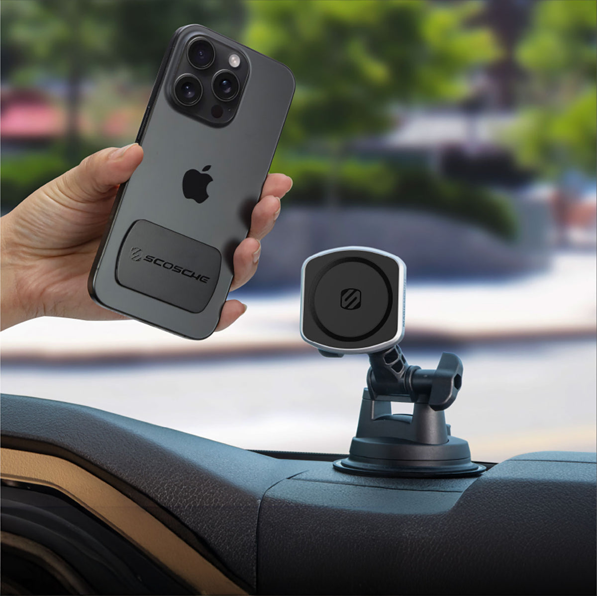 Hand holding phone up to magnetic phone mount