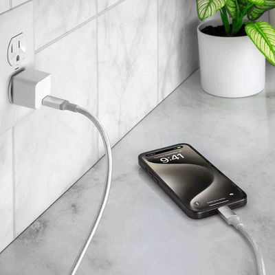 USB4 High-Performance USB-C to USB-C Braided Charge & Sync Cable charging phone in wall outlet