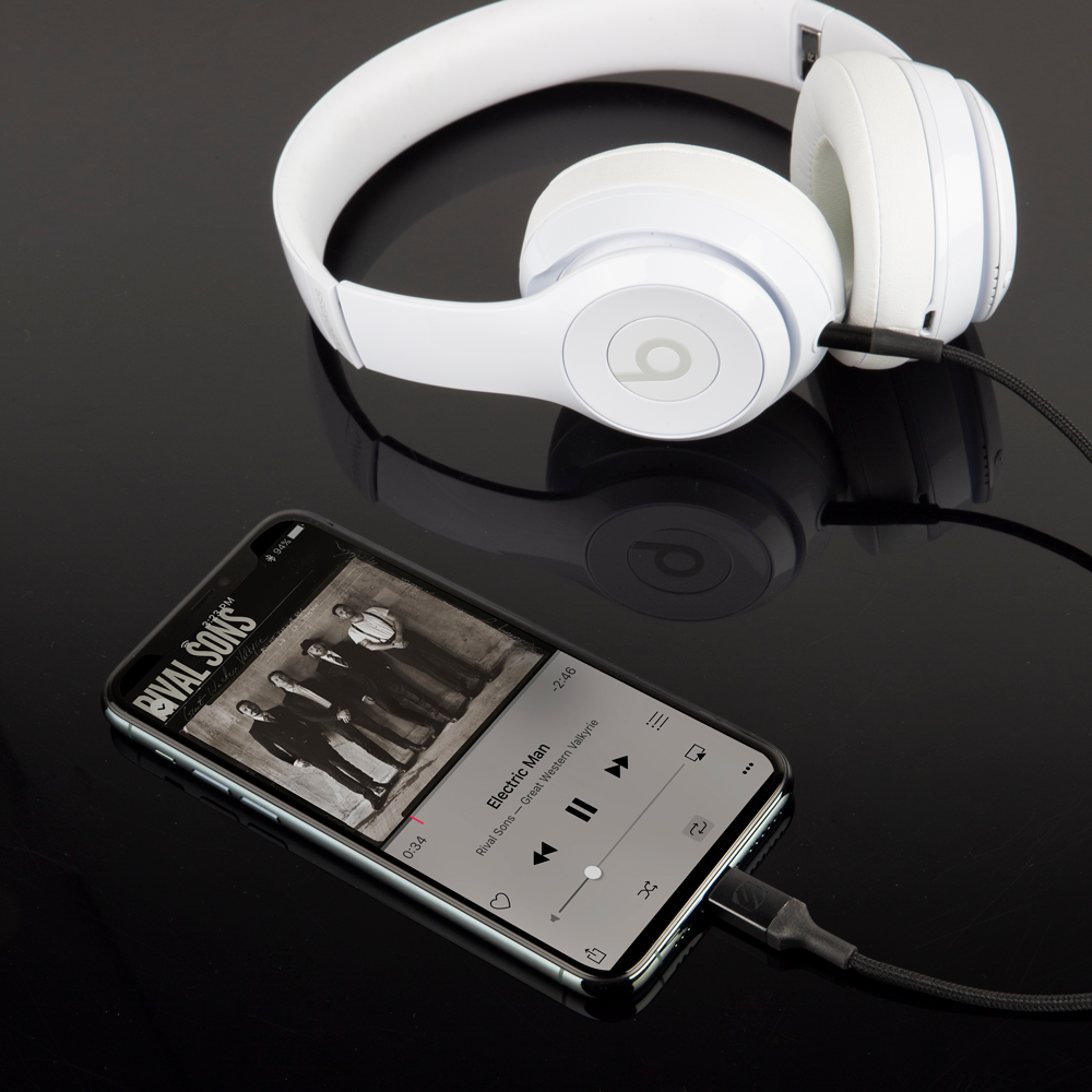 image of Auxilary to Lightning Cable  connected to iPhone and headphones