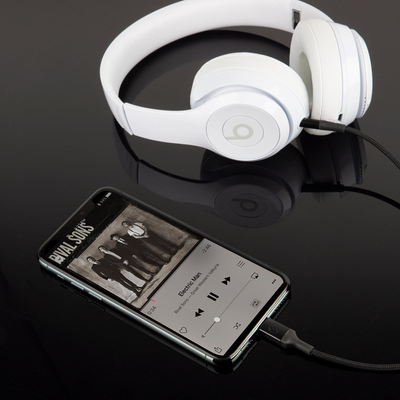 image of Auxilary to Lightning Cable  connected to iPhone and headphones