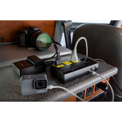 Portable 200W Power Inverter charging multiple devices