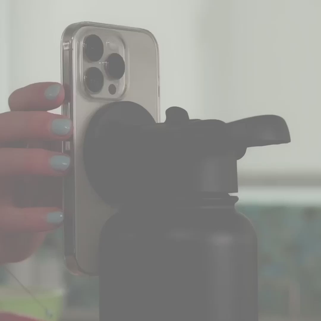 Load video: Video of people using the MagicMount Flask at home, work and in various spaces, attaching the phone to the magnetic cap of the flask