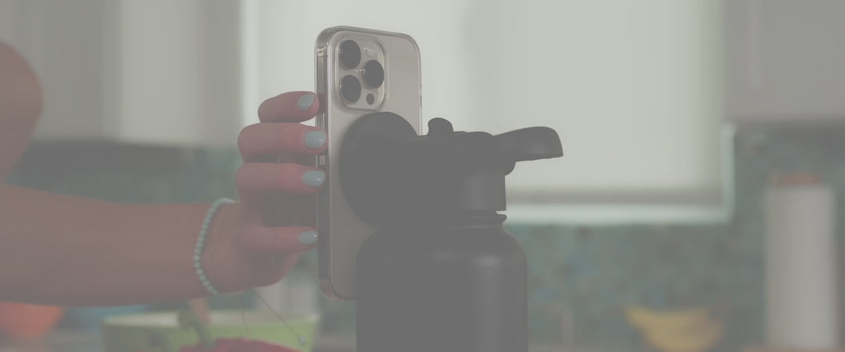 Load video: Video of people using the MagicMount Flask at home, work and in various spaces, attaching the phone to the magnetic cap of the flask