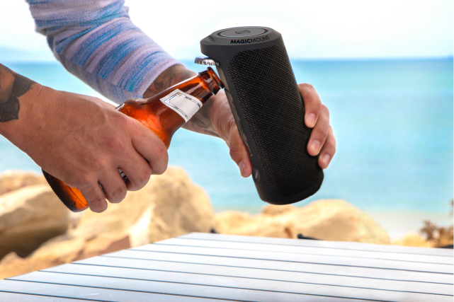 Person using the bottle opener found on the BoomBottle